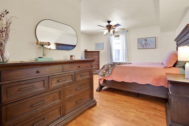 bedroom featuring ceiling fan and light wood-type flooring