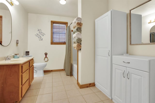 full bathroom with shower / bath combination with curtain, vanity, tile patterned floors, and toilet