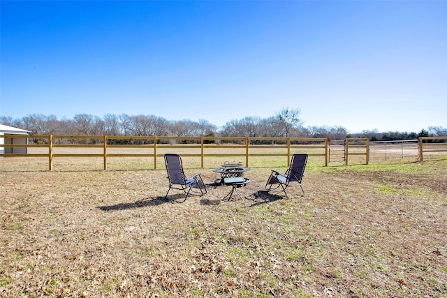 view of yard with a rural view