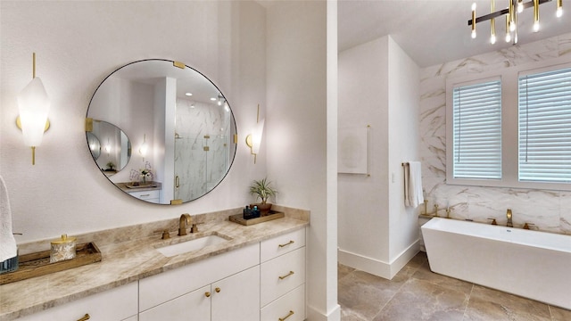 bathroom featuring vanity and separate shower and tub