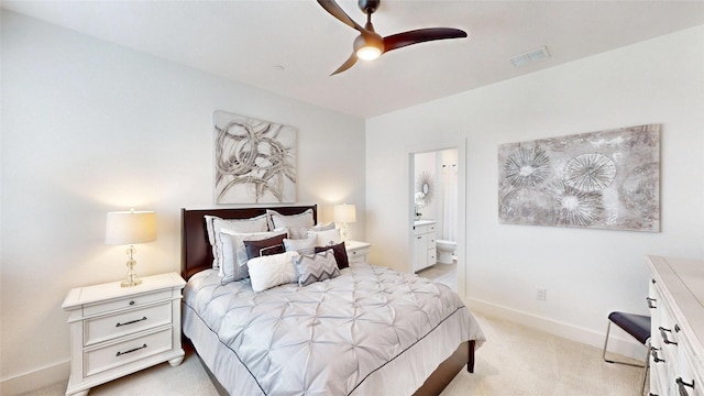 carpeted bedroom featuring connected bathroom and ceiling fan