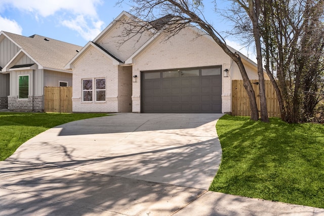 view of front facade with a garage and a front lawn