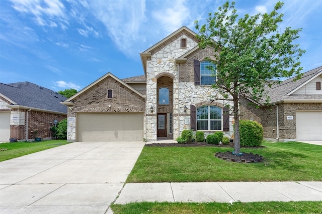 view of front of home with a garage and a front yard