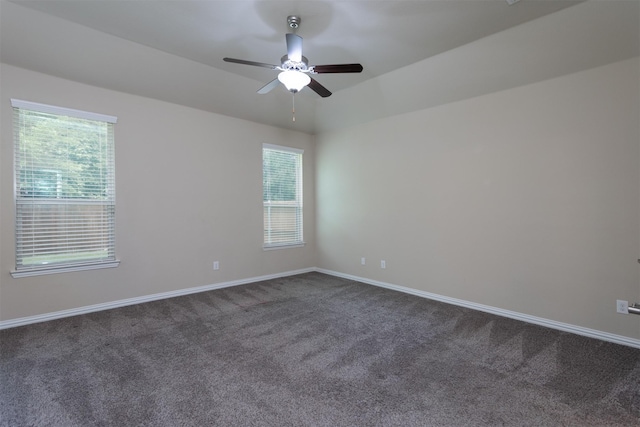 spare room featuring carpet floors and ceiling fan