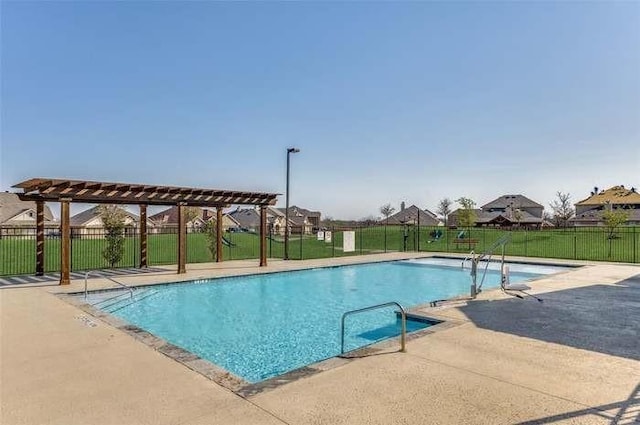 view of swimming pool featuring a pergola and a patio