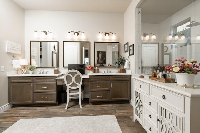 bathroom featuring vanity and a shower