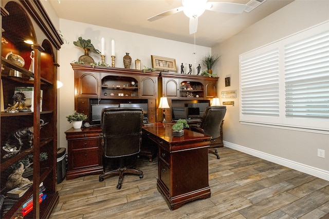 office area with hardwood / wood-style floors and ceiling fan