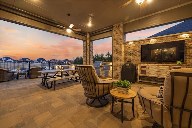 view of patio / terrace featuring area for grilling and ceiling fan