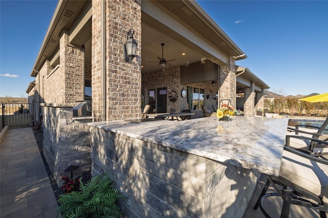 view of patio / terrace with ceiling fan