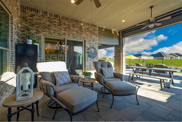 view of patio featuring ceiling fan