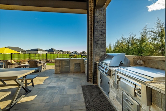 view of patio / terrace with a grill and exterior kitchen