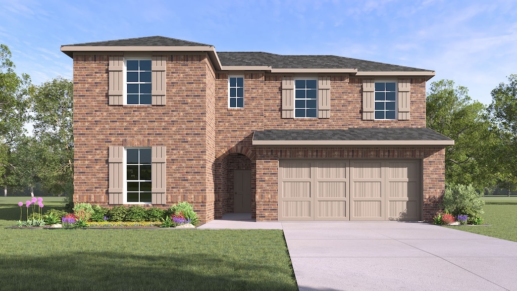 view of front of property featuring a garage and a front yard