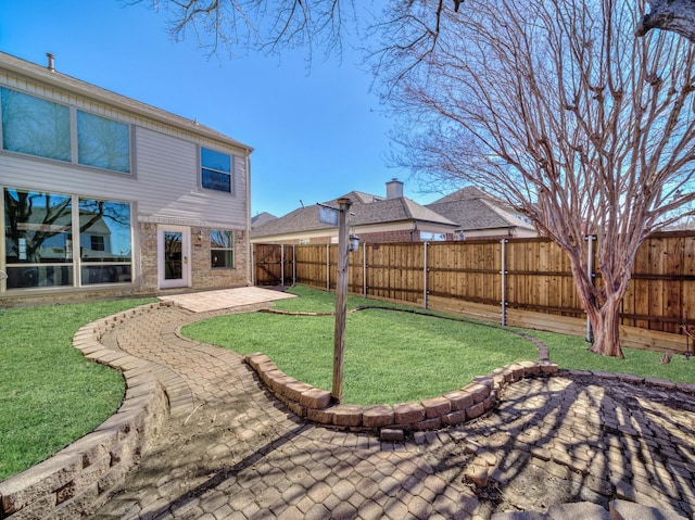 view of yard featuring a fenced backyard and a patio