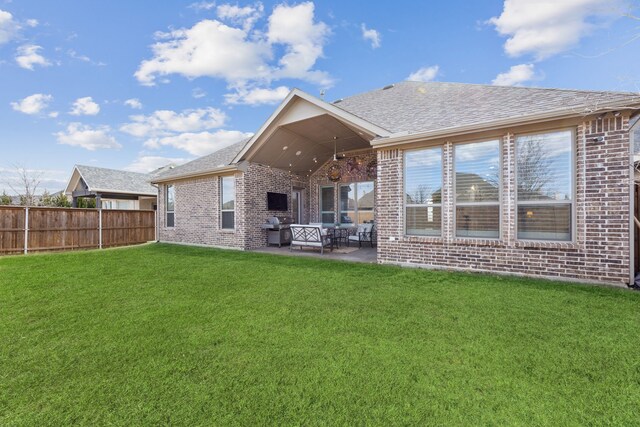 view of patio with area for grilling and outdoor lounge area