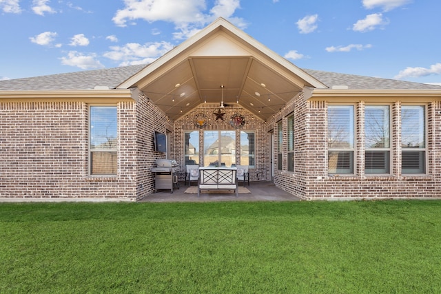 back of house featuring a lawn, a patio, and ceiling fan