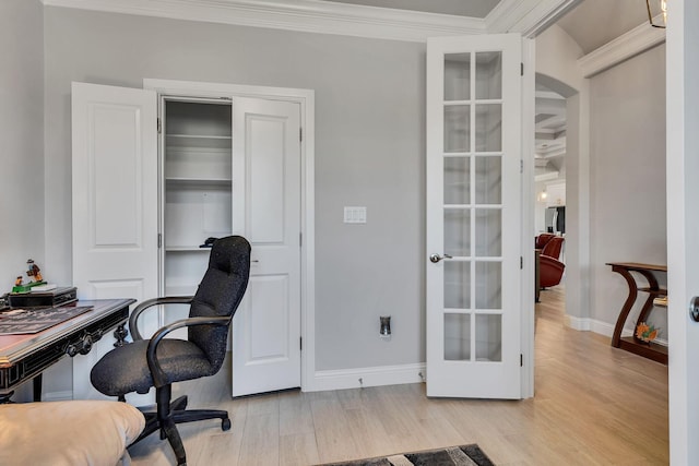 office space with french doors, crown molding, and light hardwood / wood-style floors