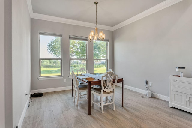 dining room with ornamental molding, light wood-type flooring, and a chandelier