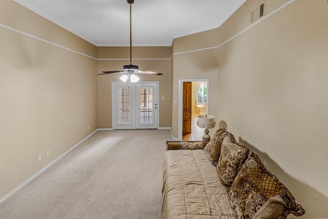 living room featuring ceiling fan and light carpet