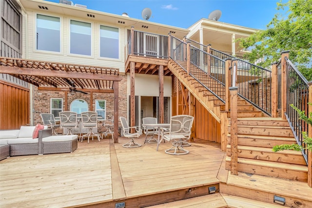 back of house with an outdoor living space and a deck