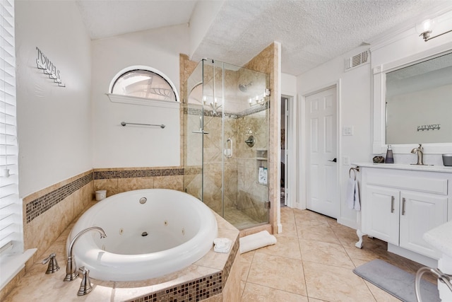 bathroom with vanity, tile patterned flooring, independent shower and bath, and a textured ceiling