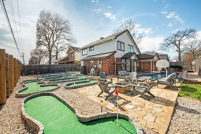 back of house featuring a fire pit, a patio, and central air condition unit