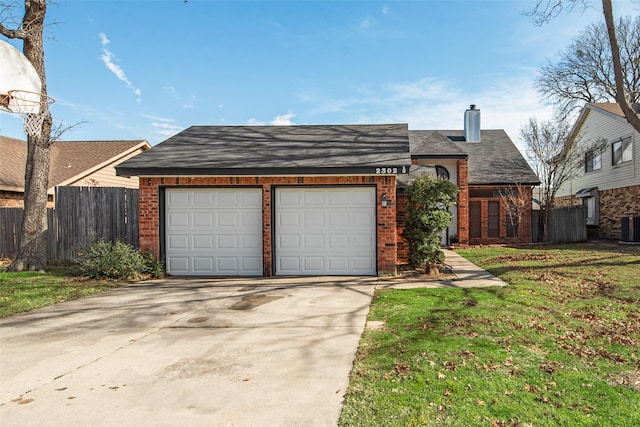 ranch-style home with central AC, a garage, and a front yard