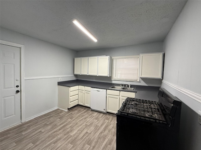 kitchen featuring white cabinetry, dishwasher, a textured ceiling, and black gas range oven