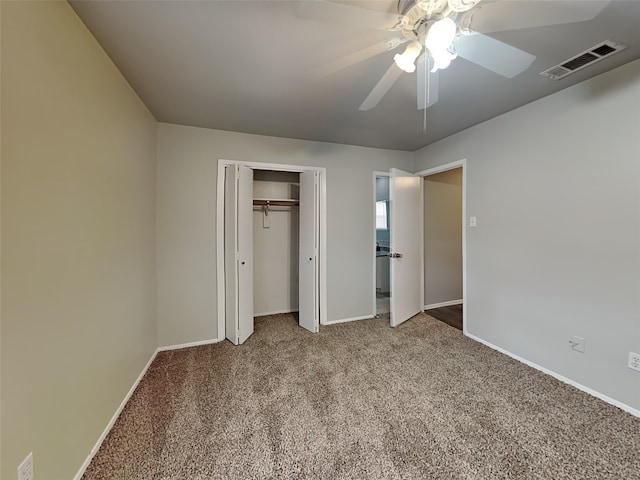 unfurnished bedroom featuring carpet, ceiling fan, and a closet