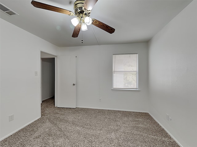 unfurnished room featuring ceiling fan and light colored carpet