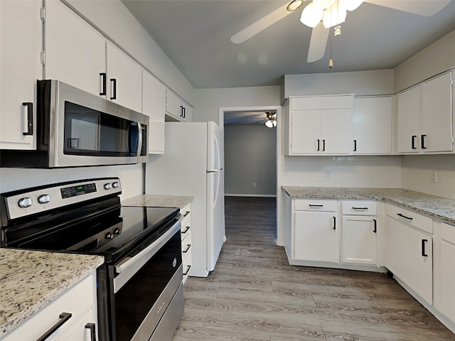 kitchen featuring decorative backsplash, light hardwood / wood-style flooring, white cabinets, and appliances with stainless steel finishes