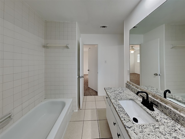 bathroom featuring ceiling fan, tile patterned floors, and vanity