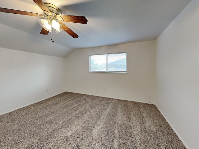 unfurnished room with vaulted ceiling, carpet, and ceiling fan