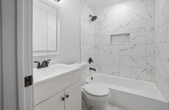 full bathroom featuring vanity, toilet, and tiled shower / bath combo