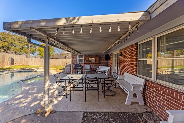 view of patio / terrace with a fenced in pool