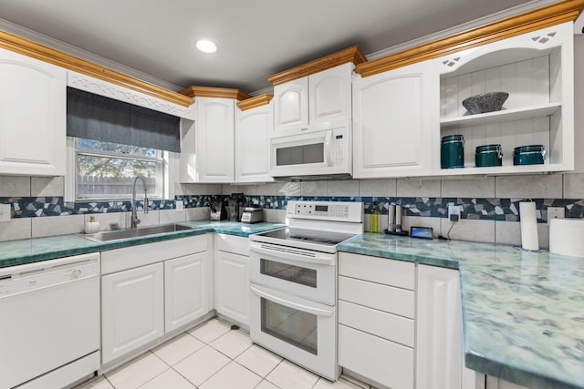 kitchen with white cabinetry, sink, white appliances, and light tile patterned floors