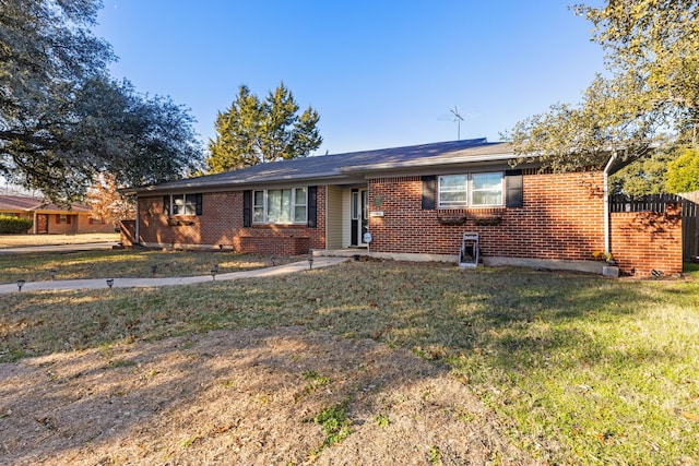 ranch-style home featuring a front yard