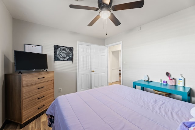 bedroom featuring ceiling fan and a closet