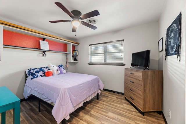 bedroom featuring hardwood / wood-style flooring and ceiling fan