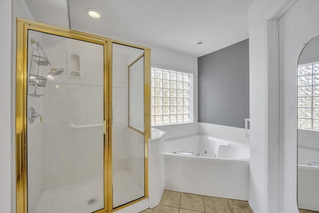 bathroom featuring tile patterned floors, plenty of natural light, and shower with separate bathtub