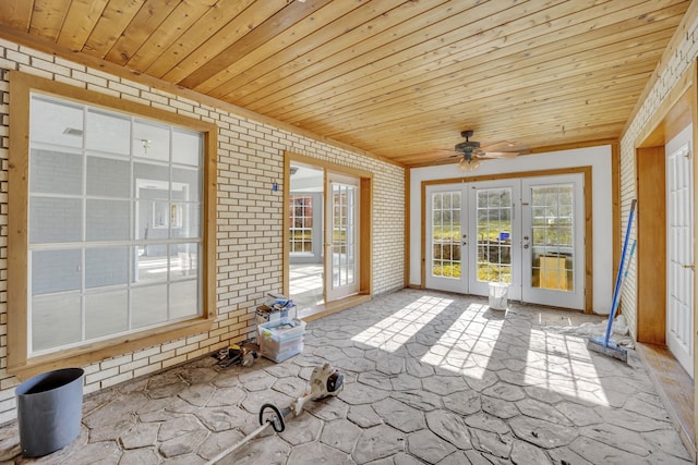 unfurnished sunroom with wooden ceiling, french doors, and ceiling fan