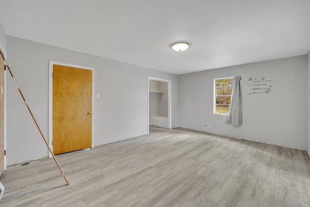 spare room with light hardwood / wood-style floors