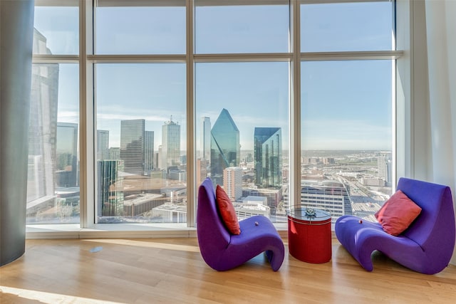 interior space with expansive windows and hardwood / wood-style floors