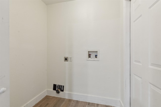 clothes washing area with washer hookup, light wood-type flooring, and electric dryer hookup