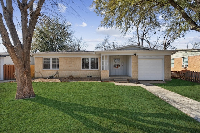 ranch-style house featuring a garage and a front yard