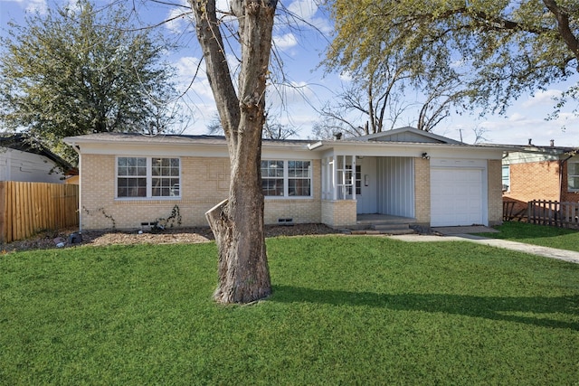 single story home featuring a garage and a front lawn