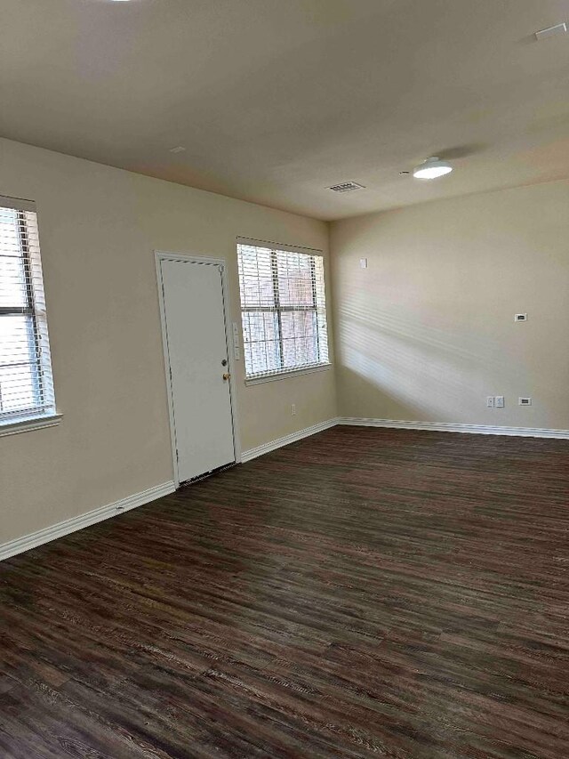 carpeted spare room featuring lofted ceiling