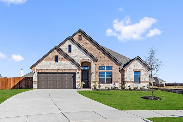 view of front of home featuring a garage and a front lawn