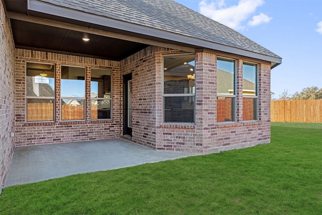 exterior space featuring a patio and a lawn