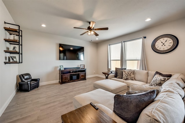 living room with ceiling fan and light wood-type flooring