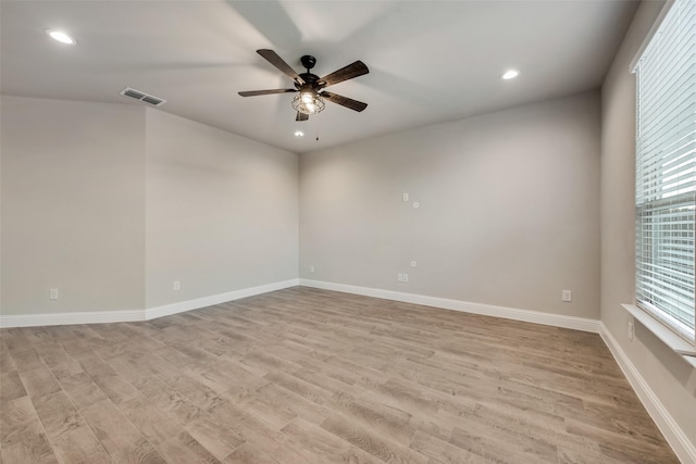 unfurnished room featuring ceiling fan and light wood-type flooring